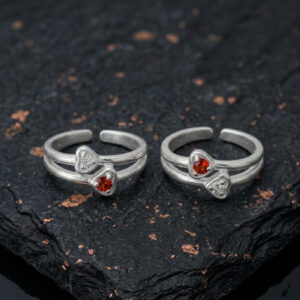 silver toe ring with red and white gemstone heart shape