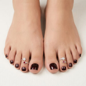 Top open silver toe ring with two stones red and white