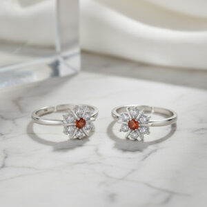 Toe ring in floral pattern with red gemstone in pure silver